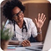 Female doctor waving at patient online.